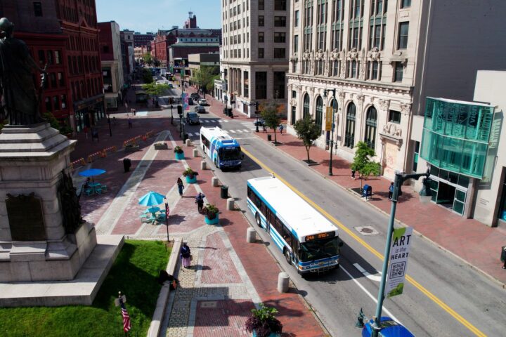 An isometric view of two Metro buses serving Congress Street in Portland, Maine.