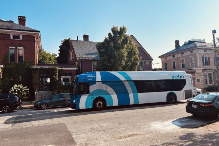 A Greater Portland Metro bus driving on Congress Street in Portland.