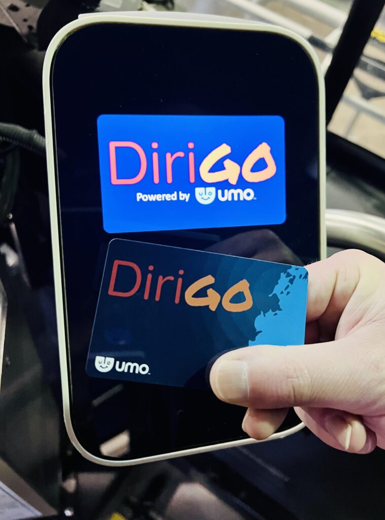 A user tapping their DiriGo card to the DiriGo reader.